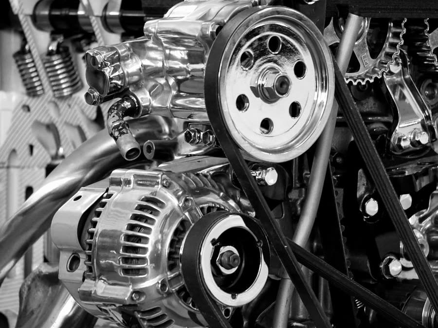 Engine pulleys and belt drive in black and white