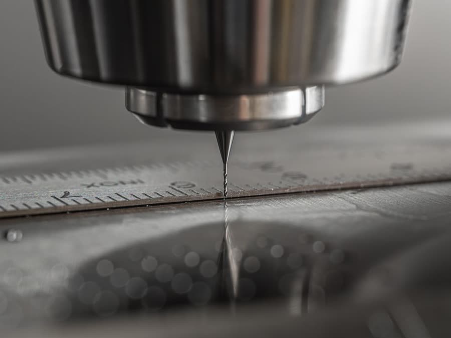 CNC milling machine cutting tool over machined steel