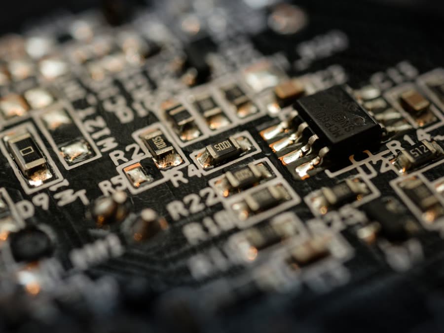 Macro view of soldered components on a dark circuit board