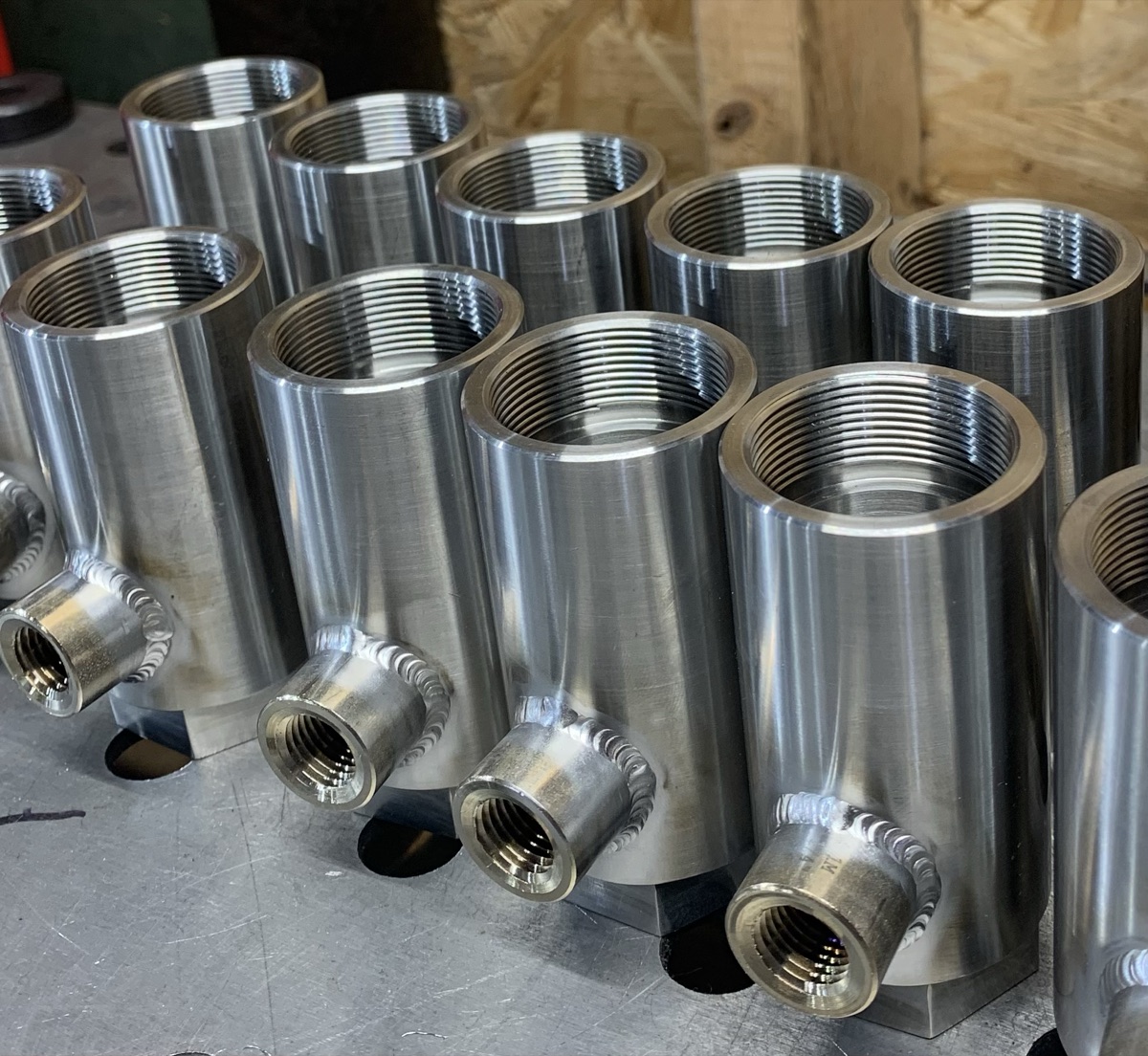 Batch of stainless steel couplings with TIG welded side fittings