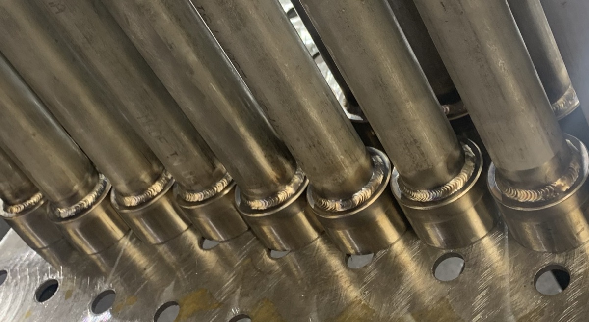 Row of stainless pipes with TIG welded joints